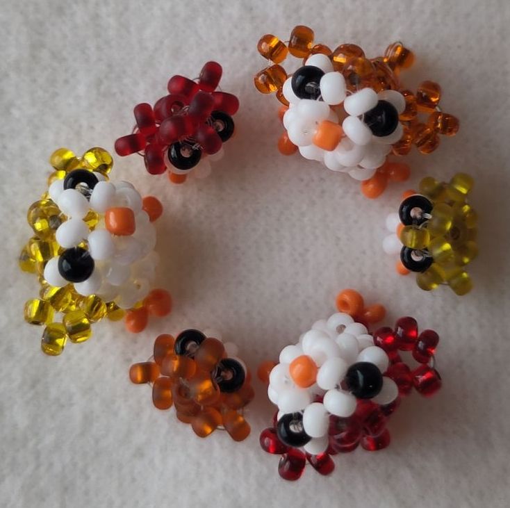 Six beaded penguins forming the Ubuntu logo.